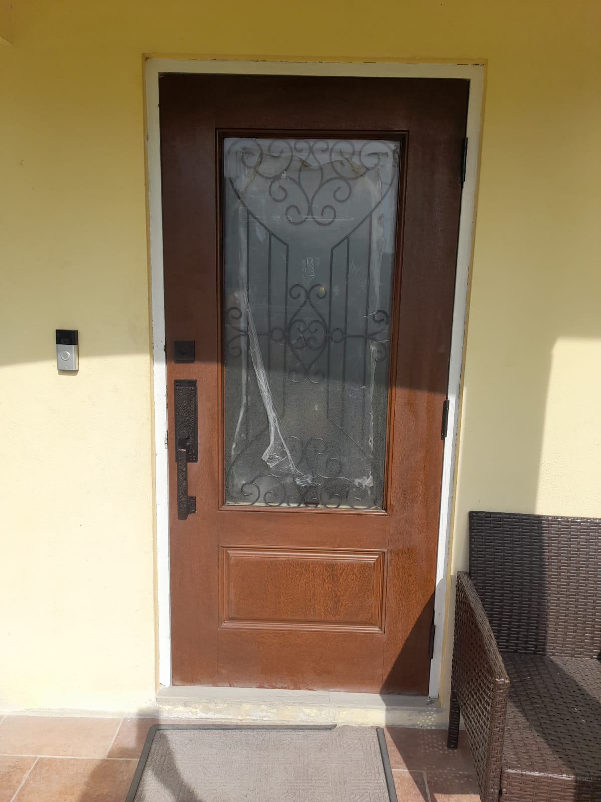 Solid wood exterior door hung in the frame, trimmed and ready for paint