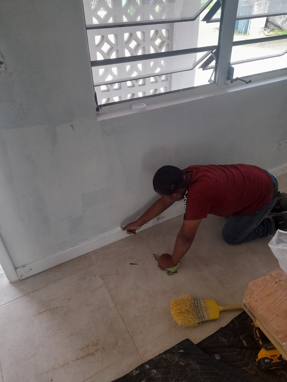 Fresh white baseboards installed and caulked tight to the wall